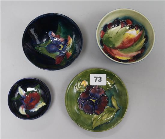 Three Moorcroft floral bowls, a dish and a vase